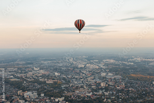 Serene Hot Air Balloon Flight Over Sprawling Cityscape at Dusk