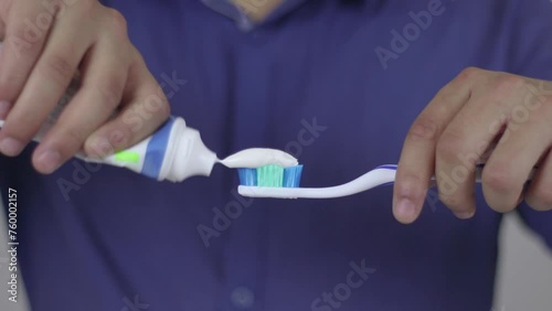 Toothpaste Dropping A Toothbrush photo