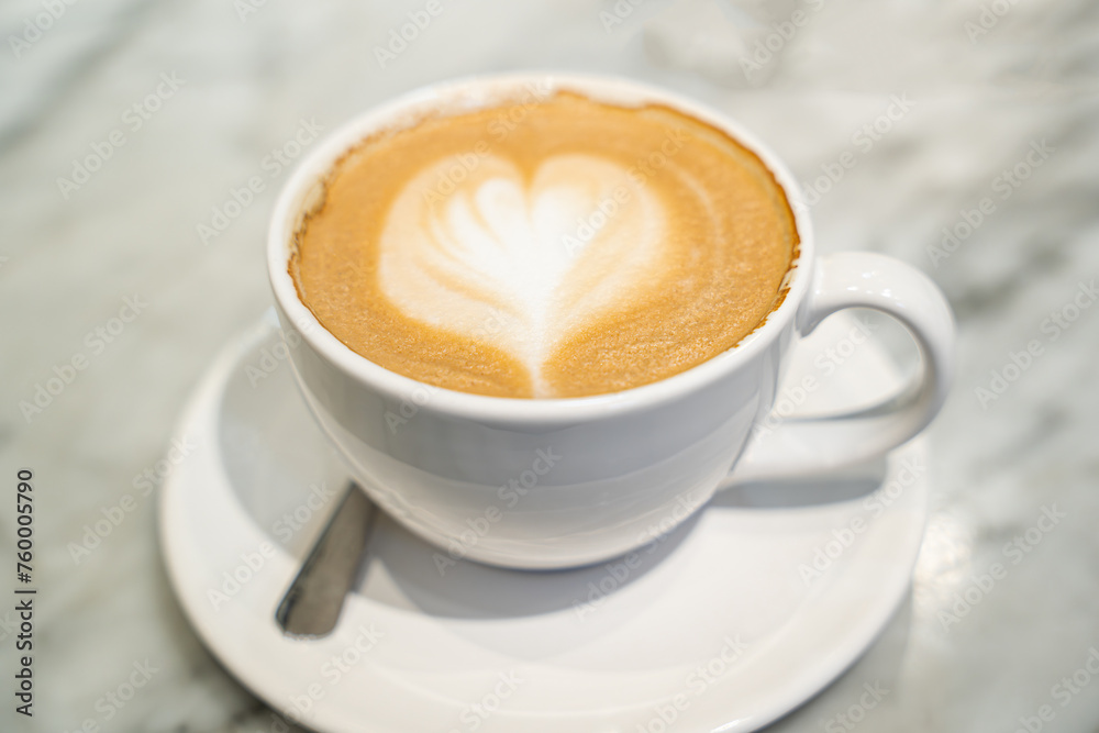 photo of Colombian coffee decors with a cream heart on the top photo of Colombian coffee decors with a cream heart on the top