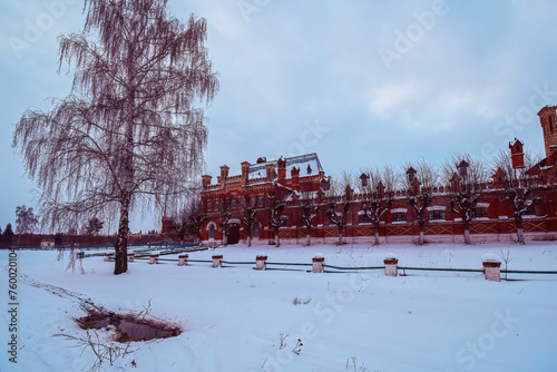 the snow-covered territory of the old stud farm with a paddock