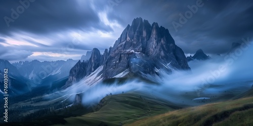 dramatic dolomite spires rising above swirling mist in an alpine valley