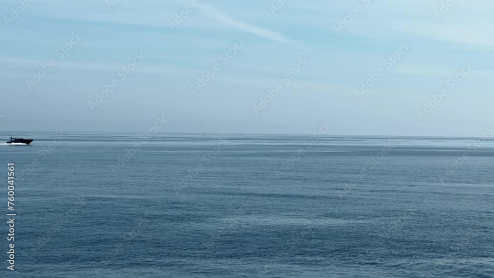 A motorboat is sailing at high speed in the sea near Monaco A motorboat is sailing at high speed in the sea near Monaco