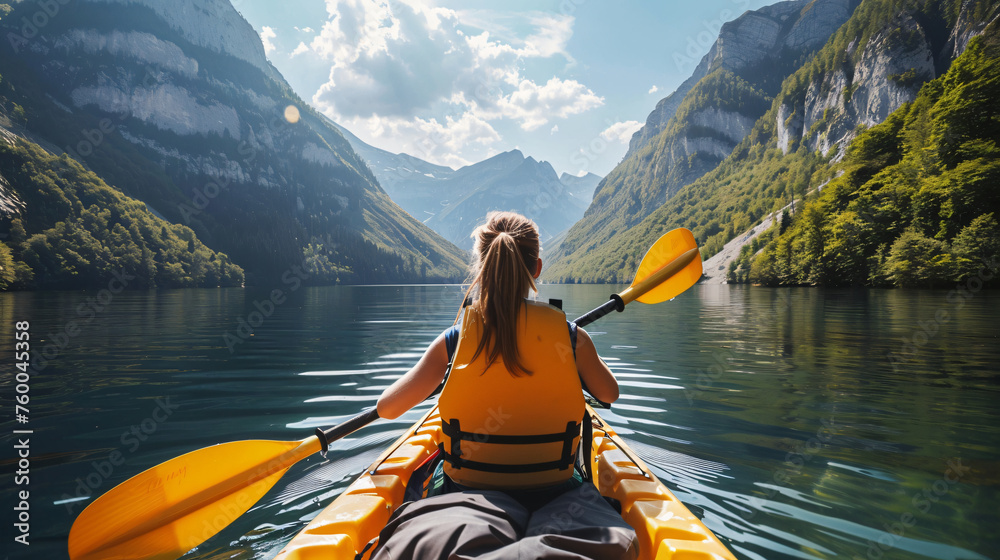 woman on the canoe boat, view from back 