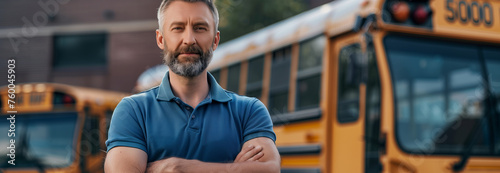 Caucasian male school bus driver is crossing his arms in confidence. photo