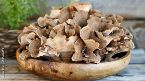 Maitake mushroom, Grifola frondosa healing fungus in wooden bowl