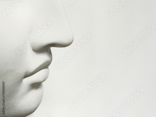 Nose and mouth on a light background, side view, copy space