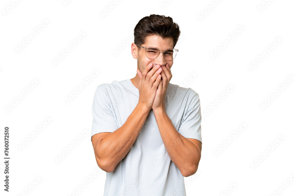 Young caucasian handsome man over isolated background happy and smiling covering mouth with hands Young caucasian handsome man over isolated background happy and smiling covering mouth with hands