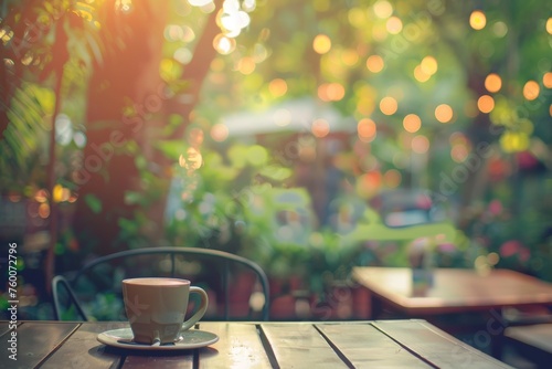 Blurred background - Coffee shop in garden blur background with bokeh. Vintage filtered image.