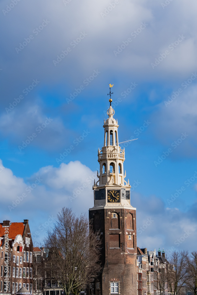 Montelbaans Tower (Montelbaanstoren) - tower from 1516, located along Oudeshans canal as part of the Walls of Amsterdam for the purpose of defending the city and the harbor. Amsterdam, Netherlands.
