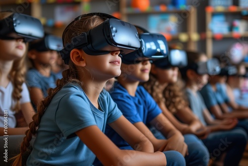Group of school children with virtual reality headsets experiencing immersive education in a classroom environment