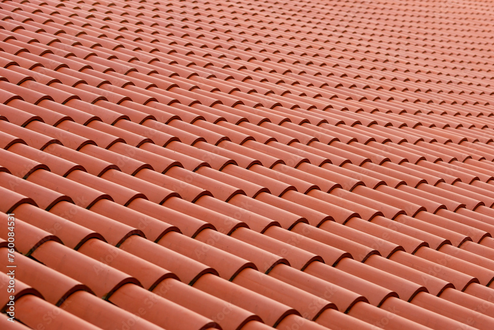 Roof made of tiles. Repeating tile elements. Painting tiles from a beautiful angle. Photo of the roof Roof made of tiles. Repeating tile elements. Painting tiles from a beautiful angle. Photo of the roof
