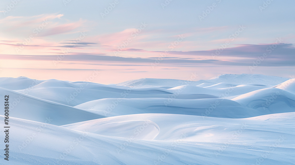 A panoramic view of undulating snowy dunes under a crisp winter sky, the contours of the snow detailed against a softly blurred sky 