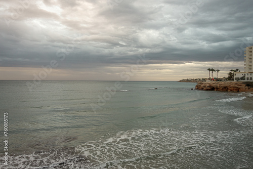 Stormy sky on La Zenia beach in Alicante. Spain photo