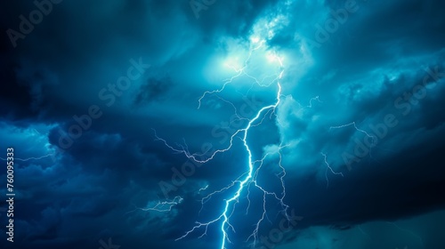 Capturing a single powerful lightning strike with a mysterious blue glow, this image exudes energy and intensity