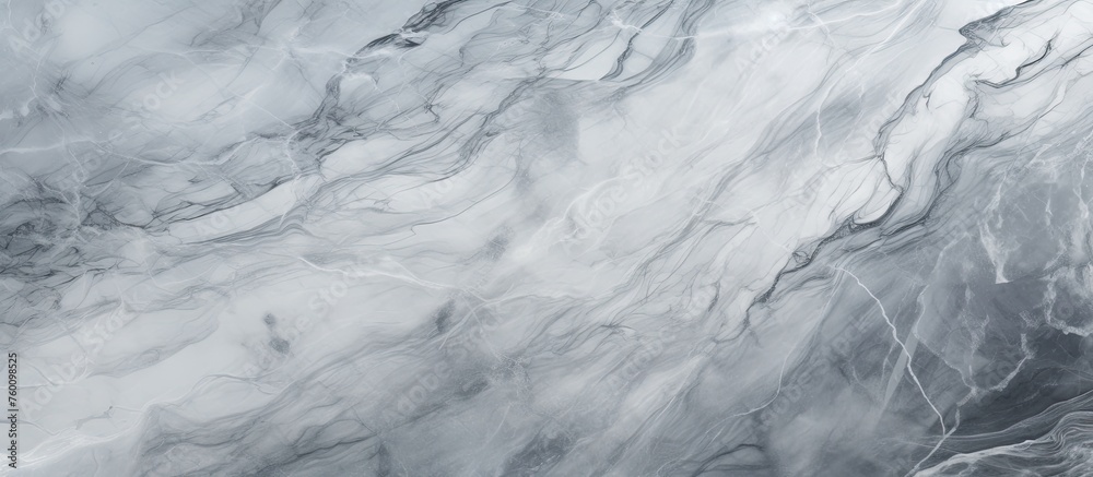 A detailed shot of a freezing gray marble texture resembling a glacial landform. The monochrome photography captures the water pattern on the ice cap, creating a stunning winter scene A detailed shot of a freezing gray marble texture resembling a glacial landform. The monochrome photography captures the water pattern on the ice cap, creating a stunning winter scene