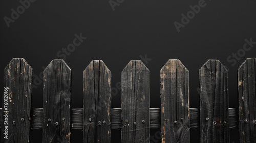 the black wooden fence on a dark background