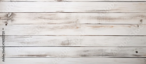 A closeup of a rectangular white wooden table with a blurred background. The table has a hardwood flooring pattern with parallel lines in a beige and brown color scheme