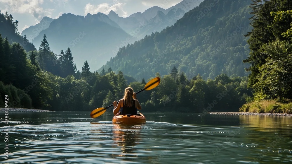 Kayaking on the river with a view of the mountains and forests