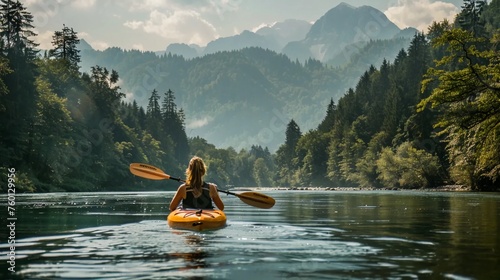 Kayaking on the river with a view of the mountains and forests © PhotoHunter