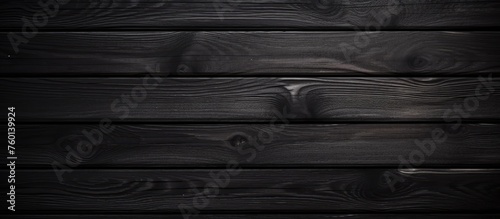 A detailed shot of a dark grey hardwood wall, resembling an automotive tire tread pattern with parallel rectangles and shades of black