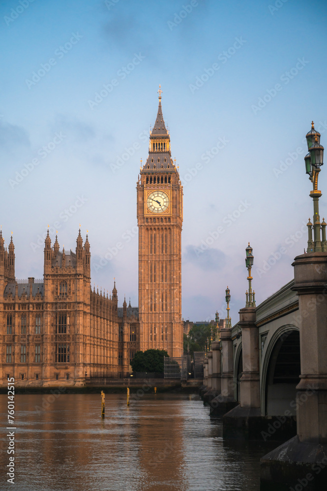 The Big Ben and Houses of Parliament against blue sky - London, UK.vertical banner