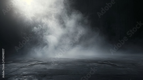An atmospheric image showcasing a misty fog hovering over a dark, mysterious ground surface, imparting a sense of intrigue