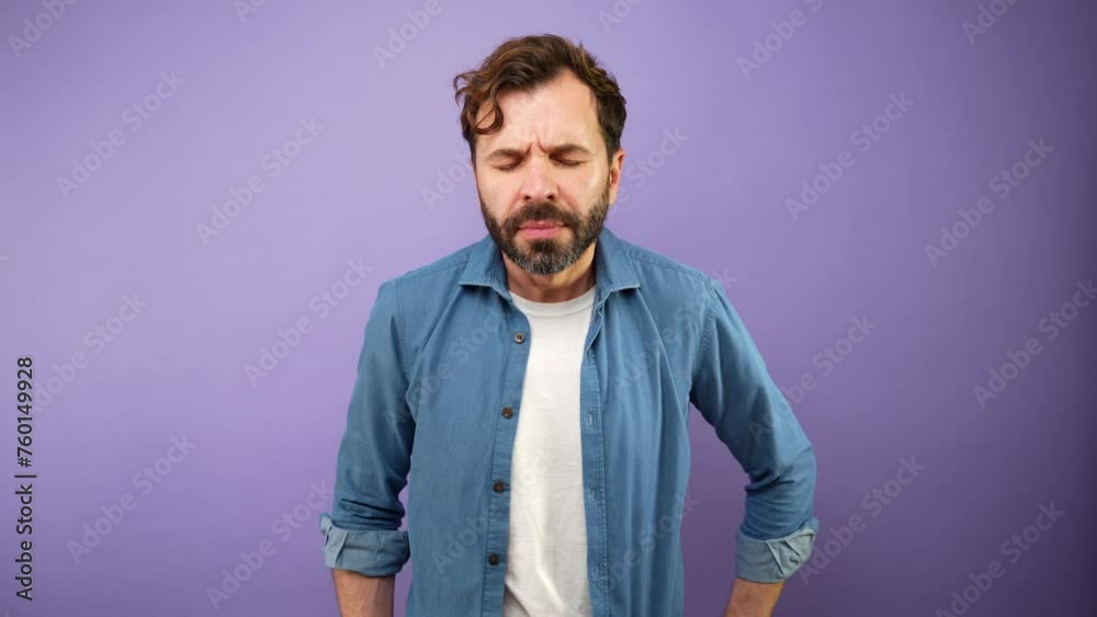 Sad man crying and feeling overwhelmed and covering his face in a studio Sad man crying and feeling overwhelmed and covering his face in a studio