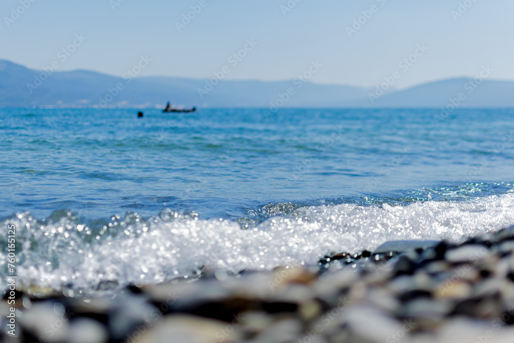 People on an island in the middle of the sea swim, bathe, have fun