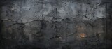 A closeup of a grey concrete wall with a beam of light penetrating through, resembling a painting of a bedrock landscape in darkness