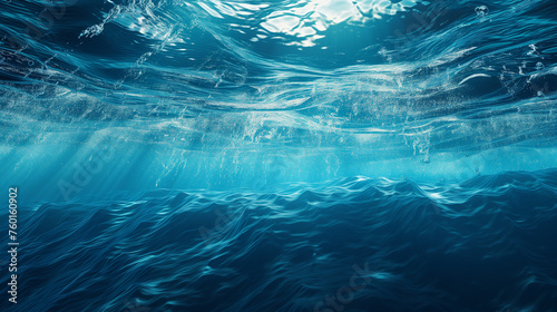 Dark blue ocean surface seen from underwater, Underwater light rays background