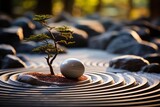 A tree emerges from a white ball in a rock garden, creating a natural landscape