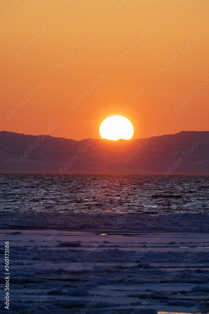 Sunset over the sea in winter