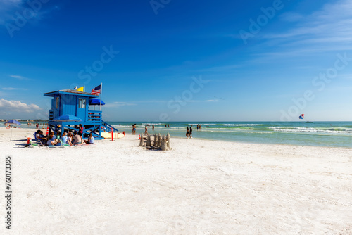 Lifeguard hut on Siesta Key Beach in a beautiful summer day with ocean and blue sky.