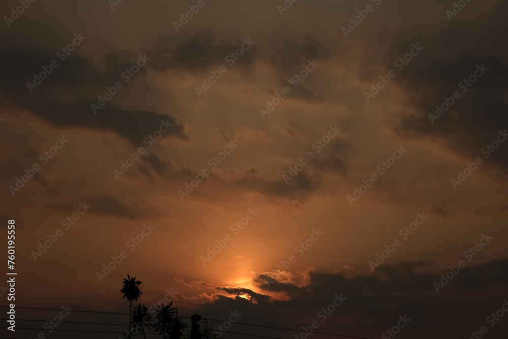 Sunset in the city, orange sky and clouds, nature background