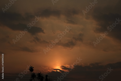 Sunset in the city, orange sky and clouds, nature background