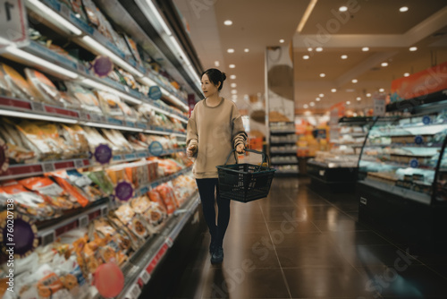 Woman Shopping for Groceries in Supermarket © 昊 周
