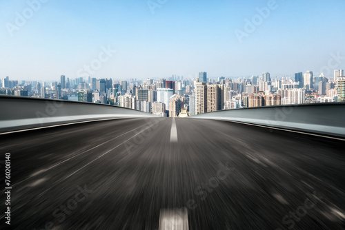 Blurred Motion Expressway Towards Bustling City Skyline © 昊 周