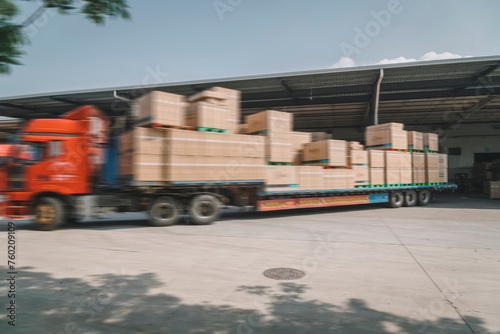 Blurred Motion of Truck Delivering Cardboard Boxes