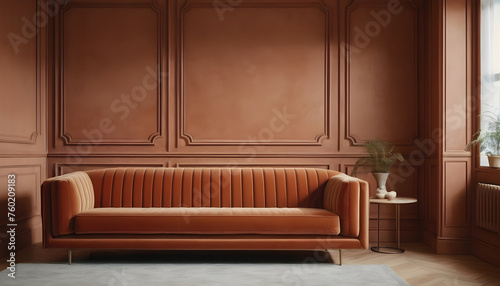 Terracotta velvet sofa near wooden panels