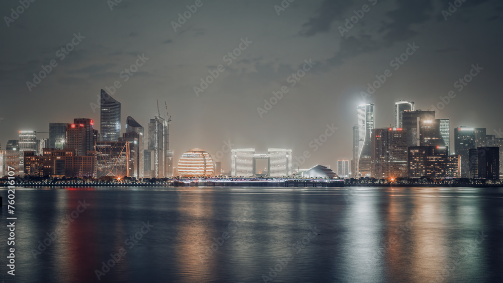 Modern City Skyline at Night with Water Reflection Modern City Skyline at Night with Water Reflection