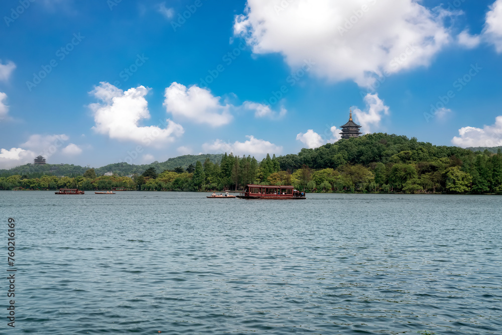 Serene Lake View with Traditional Boat and Pagoda