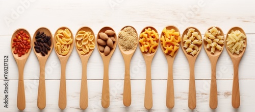 Assortment of Delicious Pasta Types Displayed on Wooden Spoons in a Rustic Kitchen Setting