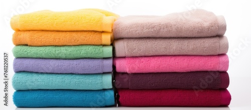 Luxurious Stack of Soft, Fluffy Towels in a Spa Setting for Relaxation and Comfort