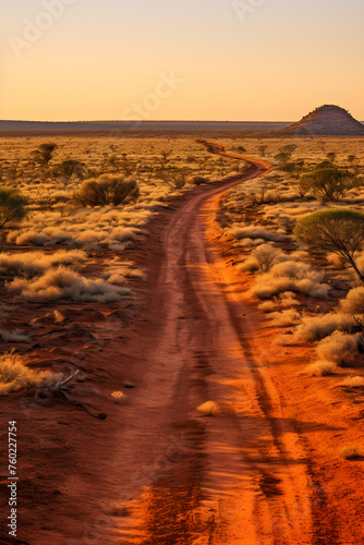 The Enduring Path: A Symbolic Journey along a Dusty Unpaved Road amidst Harsh Arid Landscape