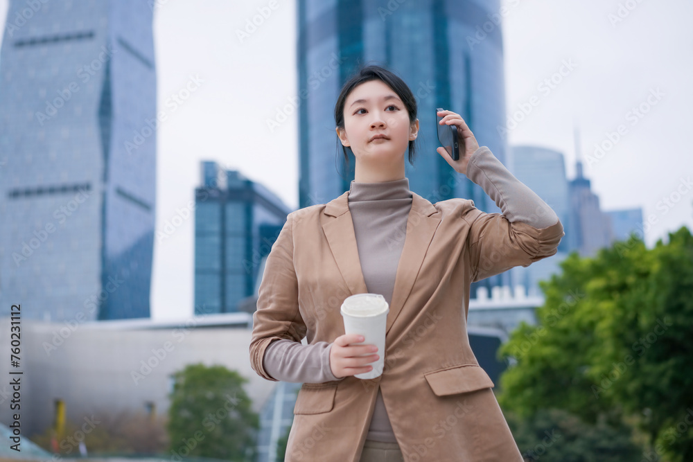 Confident Businesswoman Enjoying Coffee in the City Confident Businesswoman Enjoying Coffee in the City