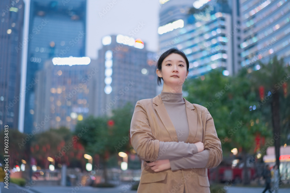 Confident Businesswoman in Urban Evening Setting Confident Businesswoman in Urban Evening Setting