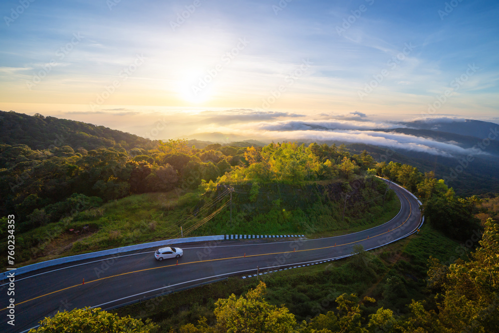 Aerial view of national park Inthanon, cars driving on curved, zigzag curve road or street on mountain hill with green natural forest trees in rural area of Chiang Mai, Thailand. - obrazy, fototapety, plakaty 