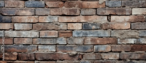 A detailed closeup shot of a brick wall showcasing the intricate patterns and textures of each individual brick. The image captures the art and beauty of brickwork as a building material