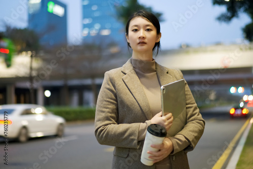 Confident Businesswoman on Urban Evening Commute
