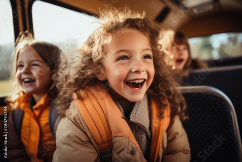Joyful ride: fun students on a school bus, sharing laughter and creating memories on their journey to school, embodying the spirit of friendship and adventure during their commute together © Ruslan Batiuk